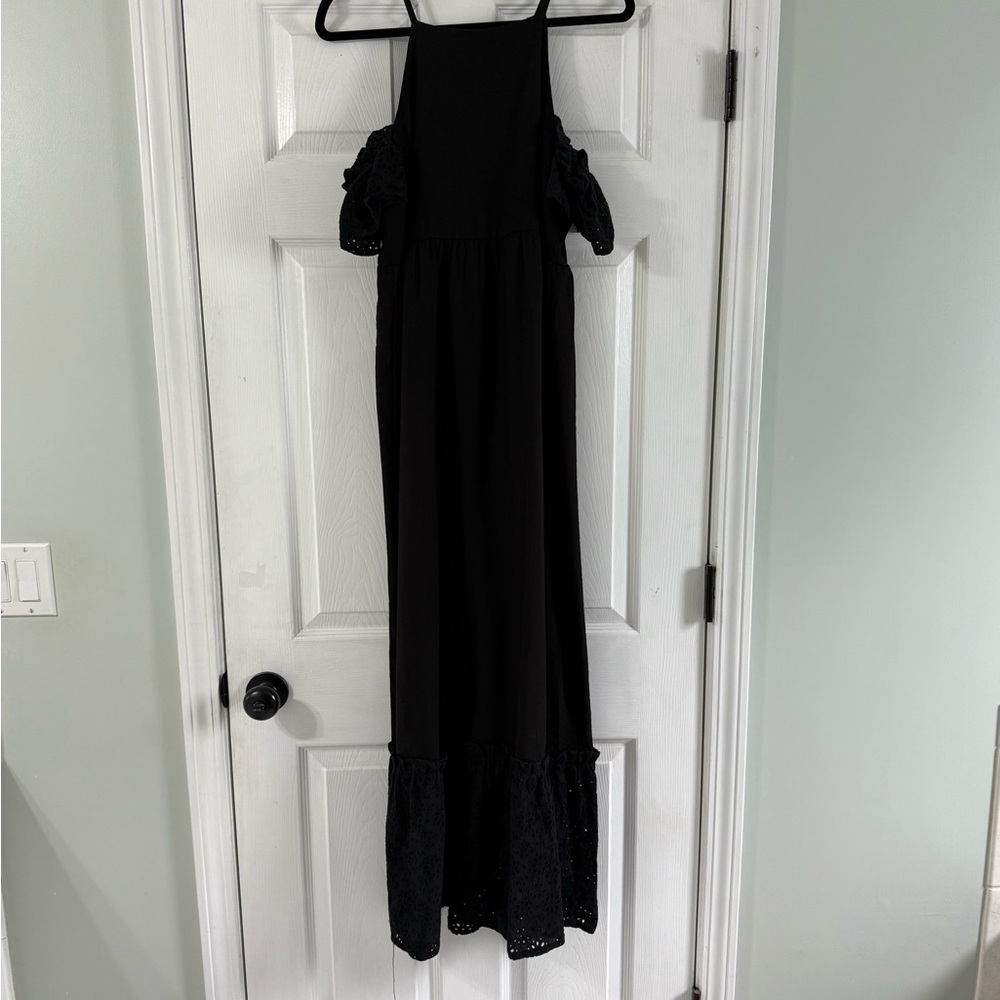 Gorgeous black dress with drip sleeves and eyelet details